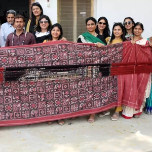FLO members interact with weavers of dying art Telia Rumal of Puttapaka